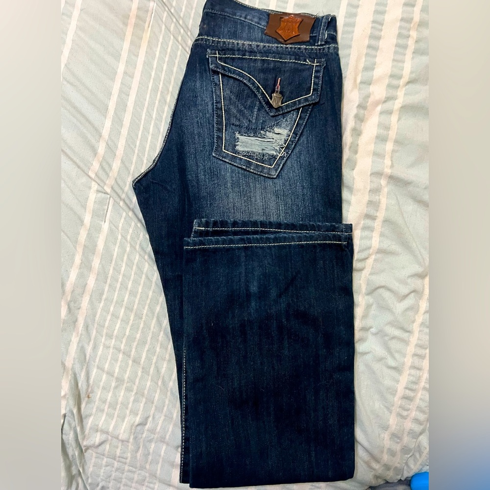 Men’s distressed monarchy jeans